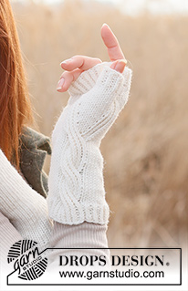 Perfect Twist / DROPS 234-55 - Gebreide polswarmers in DROPS Merino Extra Fine. Het werk wordt gebreid met kabels.