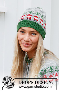 Christmas Time Hat / DROPS 234-62 - Bonnet tricoté en DROPS Karisma. Se tricote de bas en haut, avec jacquard Père Noël et sapin de Noël. Thème: Noël.