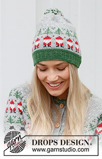 Christmas Time Hat / DROPS 234-62 - Bonnet tricoté en DROPS Karisma. Se tricote de bas en haut, avec jacquard Père Noël et sapin de Noël. Thème: Noël.