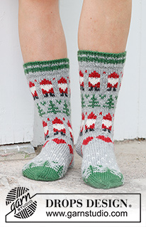 Christmas Time Socks / DROPS 234-63 - Knitted socks in DROPS Karisma. The piece is worked top down with coloured Santa, Christmas tree and heart-pattern. Sizes 35 – 43. Theme: Christmas.