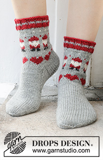 Santa Time Socks / DROPS 234-65 - Knitted socks in DROPS Karisma. The piece is worked top down with coloured Santa and heart-pattern. Sizes 35 – 43. Theme: Christmas.