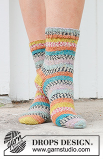 Winter Festival Socks / DROPS 234-69 - Knitted socks in DROPS Fabel. The piece is worked top down in stockinette stitch. Sizes 35 – 43 = US 4 1/2 – 12 1/2.
