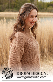 Cracked Walnuts Sweater / DROPS 235-1 - Alhaalta ylös neulottu pusero DROPS Kid-Silk- ja DROPS Puna- / DROPS Merino Extra Fine -langoista. Työssä on kohoneuletta, ainaoikeinneuletta, palmikoita, kaksinkertainen pääntien reunus ja joustinneuletta. Koot XS - XXL.