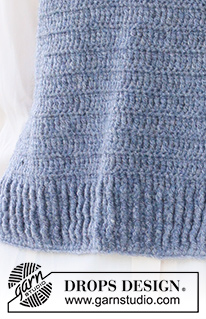 Lake View Vest / DROPS 236-32 - Crocheted vest in DROPS Sky. The piece is worked bottom up with relief-pattern, V-neck and split in the sides. Sizes S - XXXL.