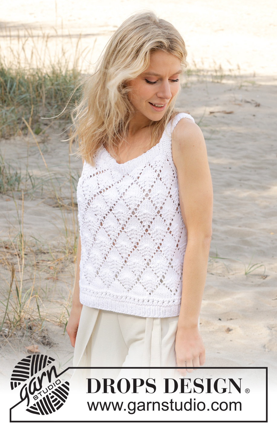 Stormlight Top / DROPS 239-34 - Top tricoté de haut en bas avec point ajouré, point mousse et fentes sur les côtés, en DROPS Paris. Du XS/S au XXXL.