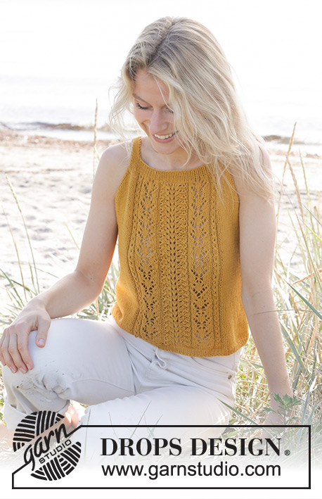 Smiling Honey Top / DROPS 240-14 - Gebreide top in DROPS Safran. Het werk wordt van onder naar boven gebreid met kantpatroon op het voorpand. Maten S - XXXL.