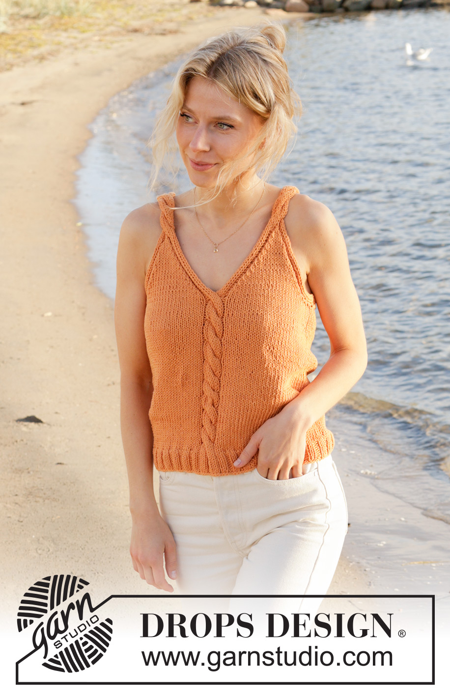 Tangerine Twist Top / DROPS 240-19 - Knitted top in DROPS Paris. Piece is knitted bottom up with cables and V-neck. Size XS – XXL.