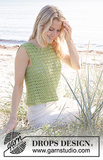 Boogie Nights Top / DROPS 241-23 - DROPS Cotton Merino lõngast alt üles heegeldatud lehvikumustriga ja lõhikutega topp suurustele S kuni XXXL
