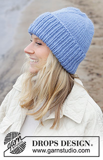 Grand Lake Hat / DROPS 242-46 - Gestrickte Mütze / Hipstermütze in DROPS Snow. Die Arbeit wird von oben nach unten glatt rechts mit Mützenaufschlag im Rippenmuster gestrickt.