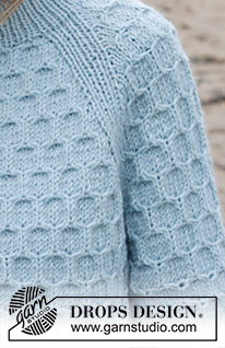 Mermaid Bay / DROPS 245-1 - Strikket bluse i DROPS Nepal. Arbejdet strikkes oppefra og ned med dobbelt halskant, raglan, bikubemønster og slids i siderne. Størrelse S - XXXL.