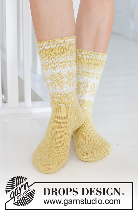 Easter Promenade Socks / DROPS 247-21 - Knitted socks in DROPS Nord. The piece is worked top down, with Nordic pattern and heel flap. Sizes 35 – 43. Theme: Easter.