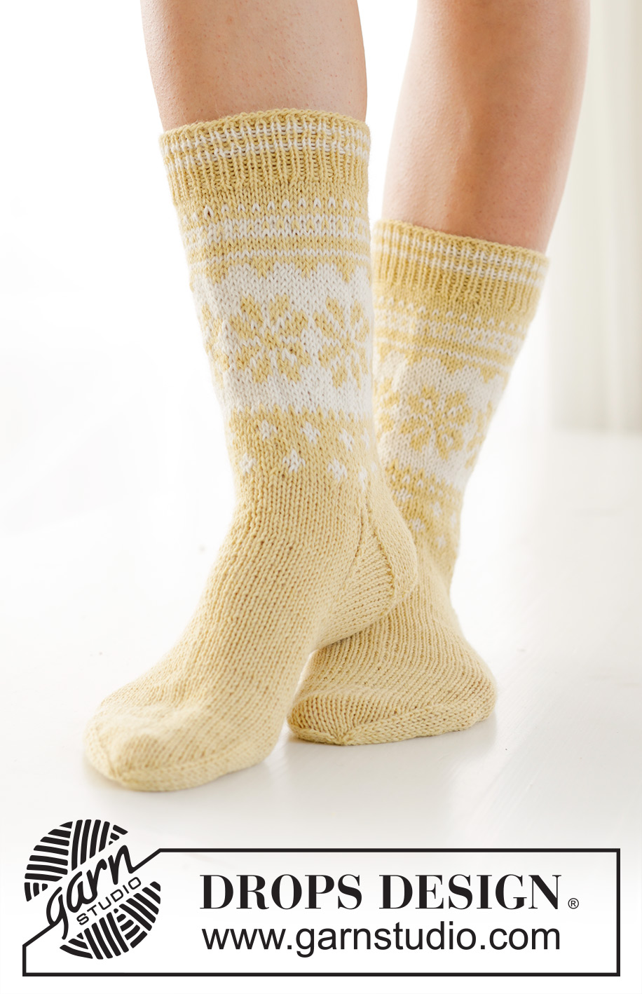 Easter Promenade Socks / DROPS 247-21 - Knitted socks in DROPS Nord. The piece is worked top down, with Nordic pattern and heel flap. Sizes 35 – 43. Theme: Easter.
