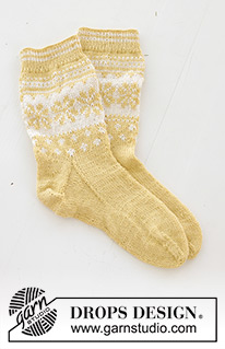 Easter Promenade Socks / DROPS 247-21 - Knitted socks in DROPS Nord. The piece is worked top down, with Nordic pattern and heel flap. Sizes 35 – 43. Theme: Easter.