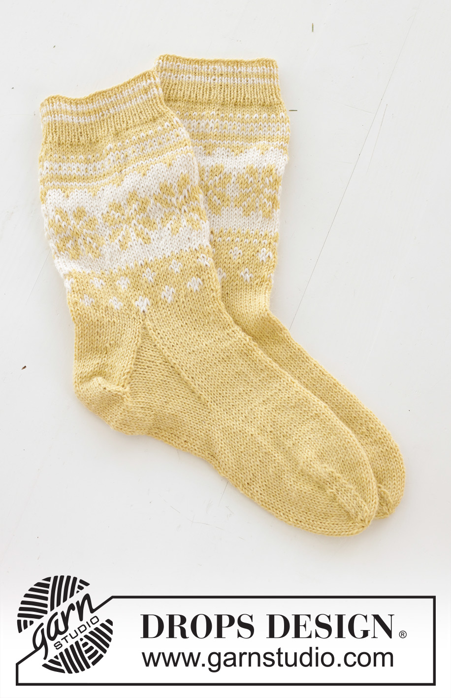 Easter Promenade Socks / DROPS 247-21 - Knitted socks in DROPS Nord. The piece is worked top down, with Nordic pattern and heel flap. Sizes 35 – 43. Theme: Easter.