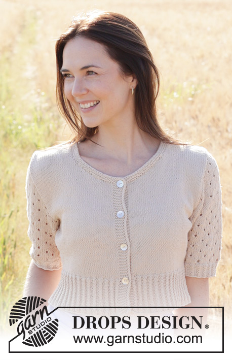Sand Cove Cardigan / DROPS 248-28 - Propínací svetr s copánky, krajkovým vzorem a krátkým rukávem pletený zdola nahoru z příze DROPS Safran. Velikost S - XXXL.