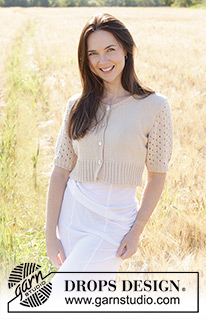 Sand Cove Cardigan / DROPS 248-28 - Propínací svetr s copánky, krajkovým vzorem a krátkým rukávem pletený zdola nahoru z příze DROPS Safran. Velikost S - XXXL.