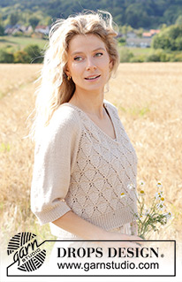 Sand Diamond / DROPS 248-6 - Raglánový pulovr s V-výstřihem, ažurovým vzorem a ¾ rukávem pletený shora dolů z příze DROPS Daisy nebo DROPS Merino Extra Fine. Velikost S - XXXL.