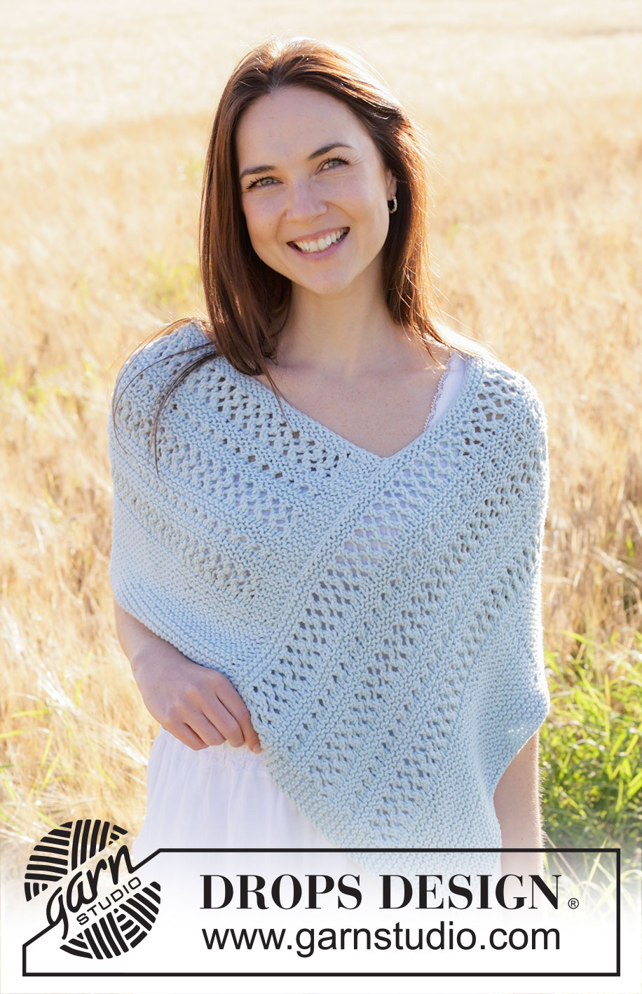 Coastal Dream / DROPS 250-32 - Knitted poncho in DROPS Paris. The piece is worked back and forth with garter stitch and lace pattern. Sizes S - XXXL.