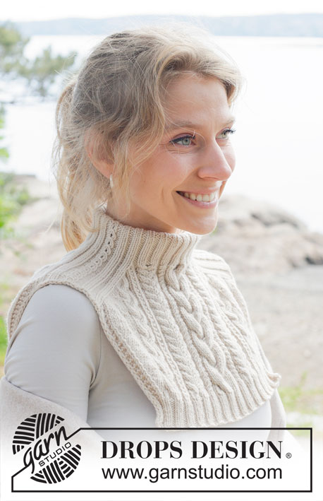 Irish Mist Neck Warmer / DROPS 253-25 - Knitted neck-warmer in DROPS Daisy or DROPS Karisma. The piece is worked top down with saddle shoulders, cables and relief-pattern.
