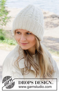Cabled Calm Hat / DROPS 253-5 - Strikket hue i DROPS Lima og DROPS Kid-Silk eller DROPS Puna og DROPS Kid-Silk. Arbejdet strikkes nedenfra og op med bukkekant og snoninger.