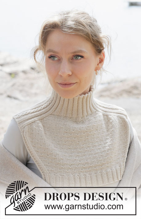 Embrace Winter Neck Warmer / DROPS 253-6 - Plastron tricoté de haut en bas en DROPS Daisy ou en DROPS Merino Extra Fine. Se tricote avec manches marteau et point fantaisie relief.