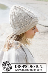 Rising Tide Hat / DROPS 253-7 - Knitted hat in DROPS Daisy or DROPS Puna. The piece is worked bottom up with lace pattern and fold-up.