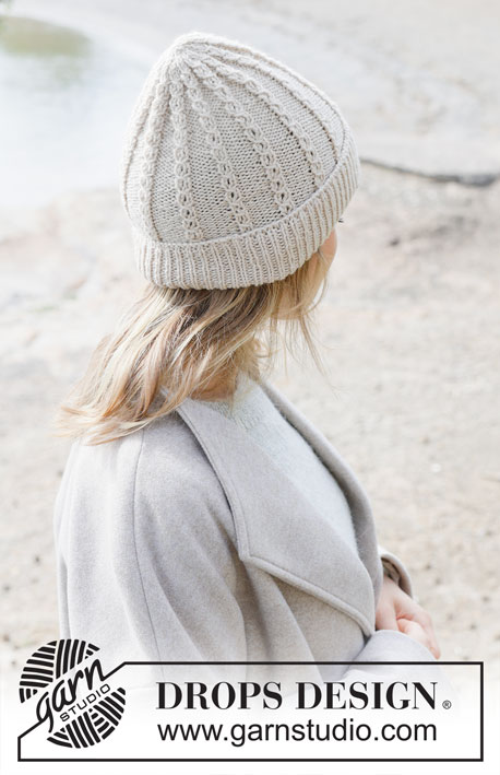 Rising Tide Hat / DROPS 253-7 - Knitted hat in DROPS Daisy or DROPS Puna. The piece is worked bottom up with lace pattern and fold-up.