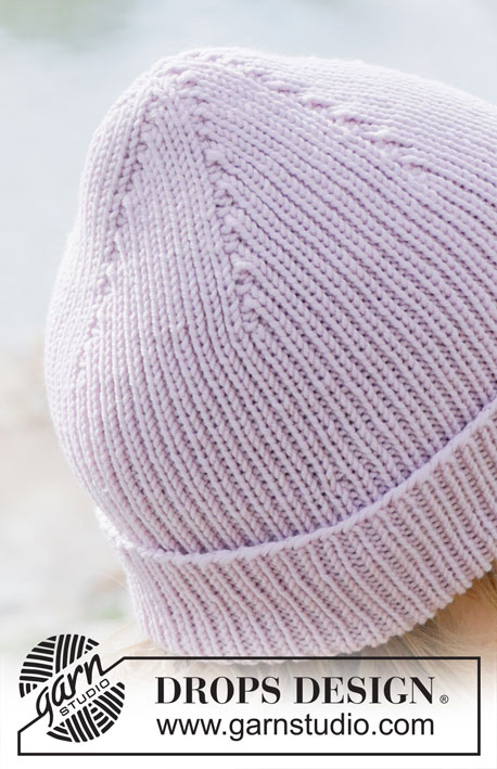Winter Blossom Hat / DROPS 253-9 - Strikket hue i DROPS Merino Extra Fine eller DROPS Karisma. Arbejdet strikkes nedefra og op med bukkekant.