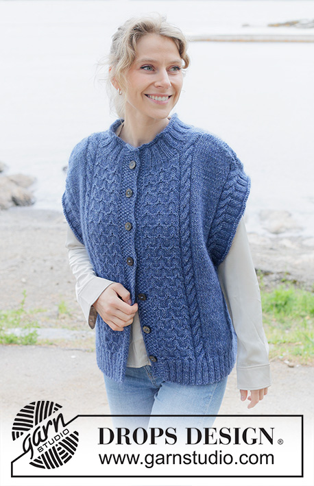 Stormy Ocean Vest / DROPS 254-25 - Knitted over-sized vest with opening in DROPS Soft Tweed and DROPS Kid-Silk. The piece is worked bottom up with cables, diagonal shoulders, round neck, rolled edges and I-cord. Sizes S - XXXL.