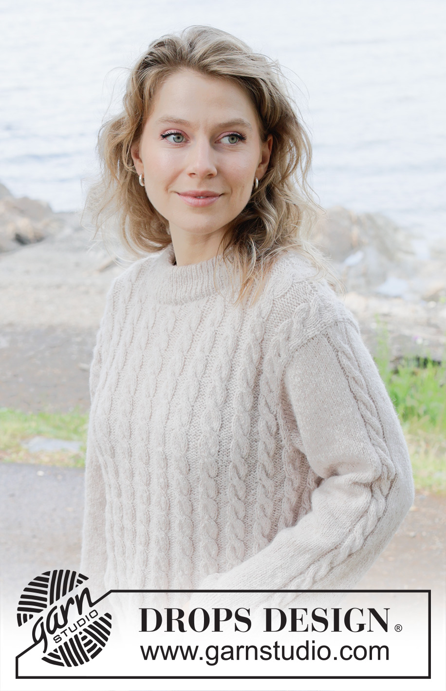 Cable Mirage / DROPS 255-28 - Knitted jumper in DROPS Sky. The piece is worked bottom up with cables. Sizes S - XXXL.