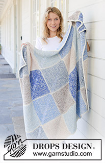 August Evenings Blanket / DROPS 256-1 - 2 DROPS Sky lõngaga kootud doomino ruutudega ja nöörkandiga tekk