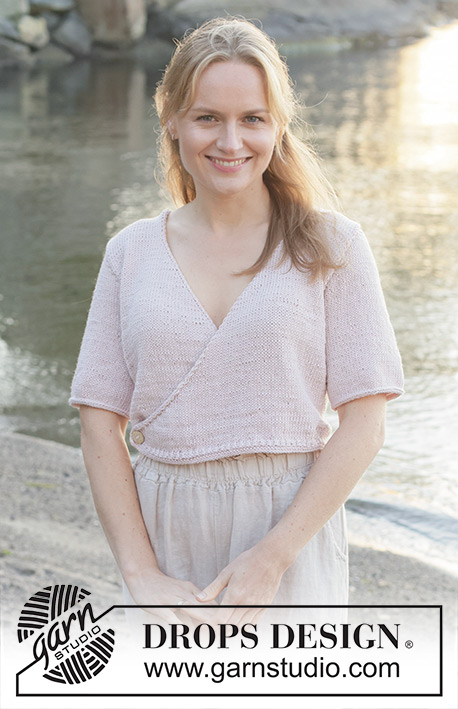 New Dawn Wrap / DROPS 257-5 - Knitted wrap-over jacket with short sleeves in DROPS Cotton Merino. The piece is worked bottom up with stocking stitch V-neck and I-cord. Sizes S - XXXL.