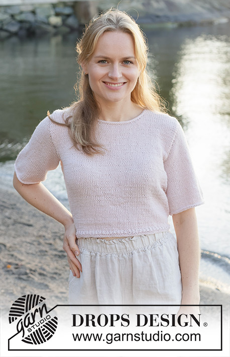 New Dawn / DROPS 257-6 - Knitted jumper with short sleeves in DROPS Cotton Merino. The piece is worked bottom up with stocking stitch and I-cord. Sizes S - XXXL.