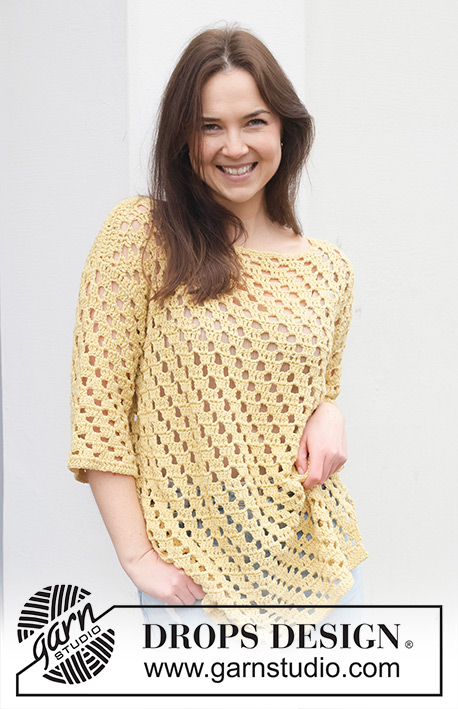 Sunny Isles / DROPS 258-36 - Crocheted long jumper in DROPS Belle. The piece is worked bottom up with lace pattern, boat-neck and ¾-length sleeves. Sizes S - XXXL.
