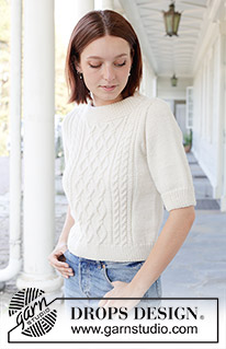 April Snow / DROPS 259-1 - Knitted jumper in DROPS Daisy or DROPS Merino Extra Fine. Piece is knitted bottom up with cables, short sleeves and double neck edge. Size: S - XXXL.