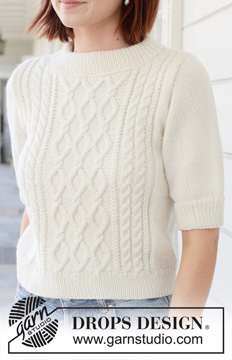 April Snow / DROPS 259-1 - Knitted jumper in DROPS Daisy or DROPS Merino Extra Fine. Piece is knitted bottom up with cables, short sleeves and double neck edge. Size: S - XXXL.