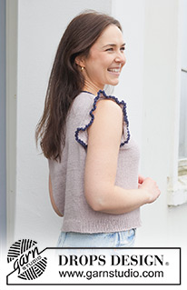 Sailor Frill / DROPS 259-11 - Gebreide top in DROPS Belle. Het werk wordt van boven naar beneden gebreid met Europeaanse schouder / diagonale schouder, PUNNIKRAND en ruche met picot. Maat: S - XXXL.