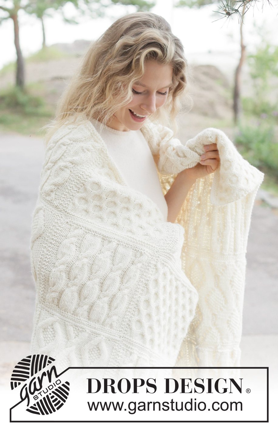 Aran Hug Blanket / DROPS 261-1 - Knitted blanket in DROPS Nepal. Piece is knitted in squares with cables.