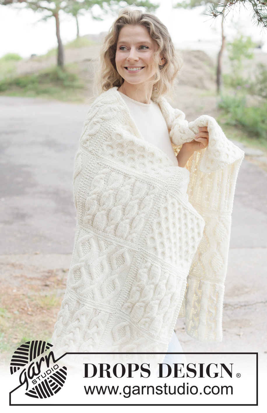 Aran Hug Blanket / DROPS 261-1 - Knitted blanket in DROPS Nepal. Piece is knitted in squares with cables.