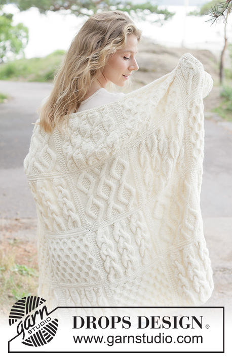 Aran Hug Blanket / DROPS 261-1 - Knitted blanket in DROPS Nepal. Piece is knitted in squares with cables.