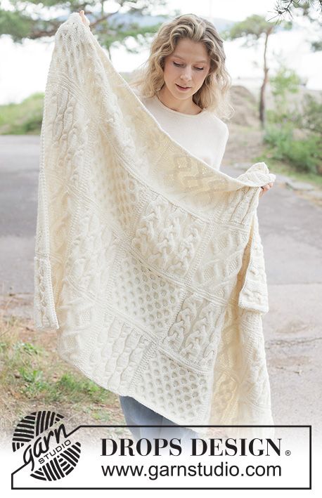 Aran Hug Blanket / DROPS 261-1 - Knitted blanket in DROPS Nepal. Piece is knitted in squares with cables.