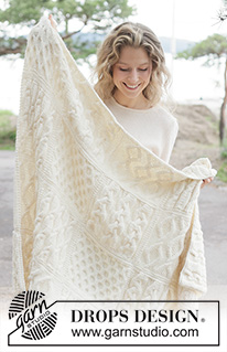 Aran Hug Blanket / DROPS 261-1 - Knitted blanket in DROPS Nepal. Piece is knitted in squares with cables.