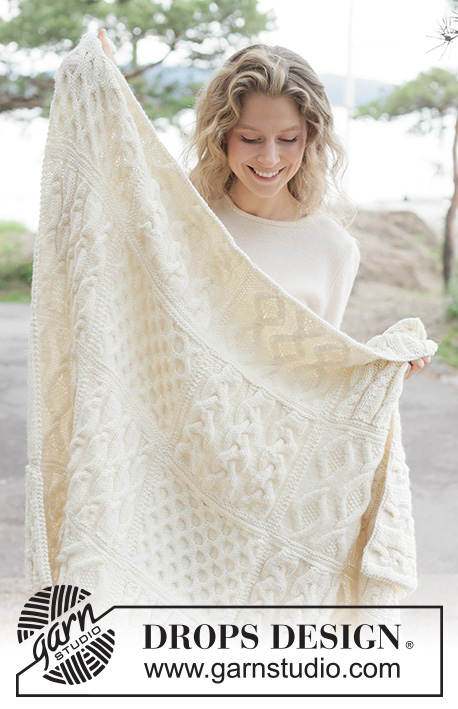 Aran Hug Blanket / DROPS 261-1 - Knitted blanket in DROPS Nepal. Piece is knitted in squares with cables.