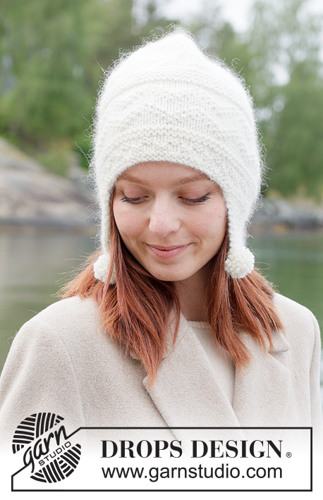 Snowfall Sonata Hat / DROPS 261-13 - Gebreide muts met oorflappen in DROPS Lima en DROPS Kid-Silk, of DROPS Merino Extra Fine en DROPS Kid-Silk. Het werk wordt van onder naar boven gebreid met reliëfpatroon.