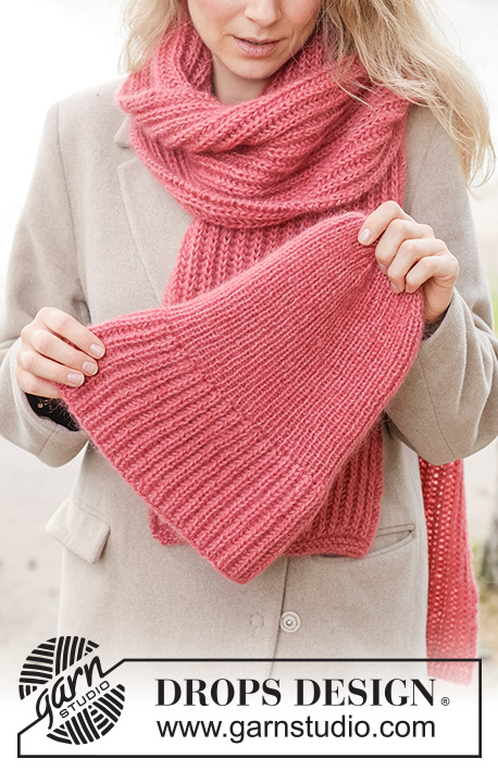 Cherry Fluff Set / DROPS 261-24 - Gebreide muts en sjaal in 1 draad DROPS Nord en 2 draden DROPS Kid-Silk, of 1 draad DROPS Alpaca en 2 draden DROPS Kid-Silk. Het werk wordt in Engelse patentsteek en boordsteek gebreid.