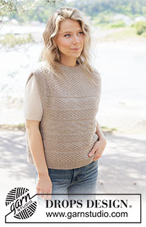 Winds of Winter Vest / DROPS 262-27 - Gilet lavorato ai ferri in DROPS Daisy o DROPS Lima. Lavorato dall’alto in basso con spalle diagonali, motivo in rilievo e collo rotondo- Taglie: S - XXXL.