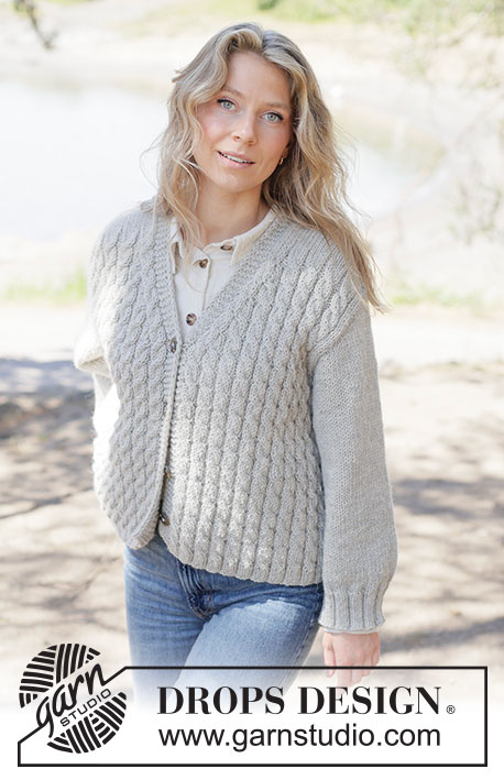 Soft Spire Cardigan / DROPS 263-27 - Knitted jacket in DROPS Nepal. The piece is worked bottom up with cables, V-neck and diagonal shoulders. Sizes XS - XXXL.