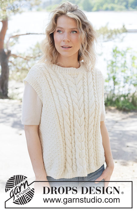 Vanilla Meringue Vest / DROPS 264-29 - Knitted vest in DROPS Alaska or DROPS Big Merino. The piece is worked bottom up with cables, moss stitch and ribbed edges. Sizes XS - XXXL.