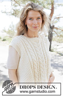 Vanilla Meringue Vest / DROPS 264-29 - Knitted vest in DROPS Alaska or DROPS Big Merino. The piece is worked bottom up with cables, moss stitch and ribbed edges. Sizes XS - XXXL.