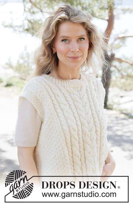 Vanilla Meringue Vest / DROPS 264-29 - Knitted vest in DROPS Alaska or DROPS Big Merino. The piece is worked bottom up with cables, moss stitch and ribbed edges. Sizes XS - XXXL.